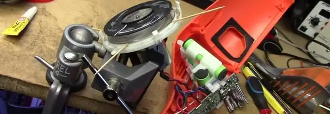 Vacuum cleaner repair parts and tools on a workbench in Bradenton, FL
