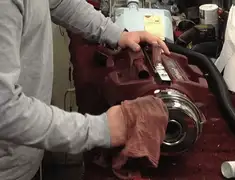 Vacuum repair technician cleaning and servicing a vacuum motor in Bradenton, FL